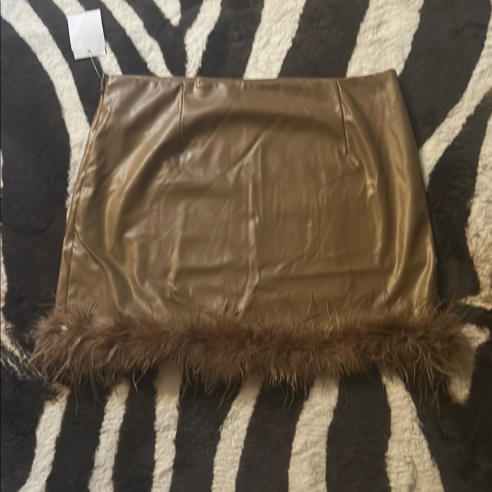 Brown pu leather skirt / feather trim